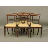 A set of six Victorian mahogany bar back dining chairs, with caned seats on fluted legs, 84cm high