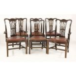 A set of six Georgian style mahogany dining chairs, including elbow chairs
