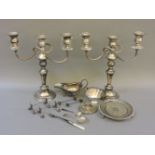 A pair of silver plated candelabra with sconces, a small plated card tray, a Georgian style sauce