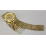 A gentleman's gold plated Tissot quartz watch, on a 9ct gold bracelet