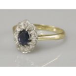 A sapphire and diamond cluster ring, marked 18ct plat