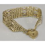 A 9ct gold seven row crossover link gate bracelet, 33.95g