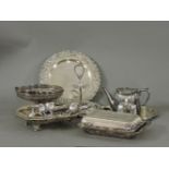 A quantity of silver plated items, including tureens, a pierced handled fruit bowl, egg cup holder