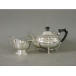A silver teapot, Sheffield 1926, and a silver sauceboat Birmingham, 1944