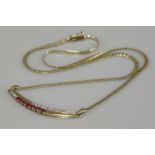 A 9ct gold ruby and diamond necklace, with a curved tapering bar centrepiece, London 1987, 6.50g