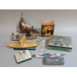 A collection of miscellaneous items, including a diorama of a doll in a kitchen, a Danbury Mint