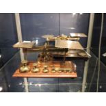 A Samuel Senior brass and oak postal scale, with a set of brass bell weights, and a set of