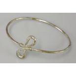 A Tiffany & Co sterling silver crossover bangle, by Elsa Peretti