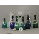 Nine glass decanters, including Georgian coloured glass mallet decanters, four green and two blue,