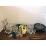 A quantity of glassware, including a pair of glass candlesticks, a cut glass bowl, etc, and a pair