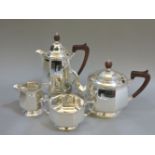 A silver teaset, Birmingham 1927, to include teapot, hot water jug, milk and sugar, all decorated
