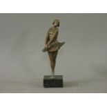 An Art Deco bronze figure of a demure girl, on a square black marble base, 27.5cm high, re-struck