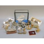 A collection of Continental silver filigree trinkets, including a boat in display case, goblet,