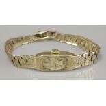 A ladies 9ct gold Rotary mechanical bracelet watch, with an oval champagne dial to a rectangular