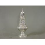 A silver sugar caster, London, 1899, 23cm long