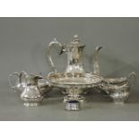 A three piece teaset, a silver plated basket, and further items