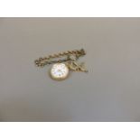 A ladies gilt metal fob watch, on rolled gold chain