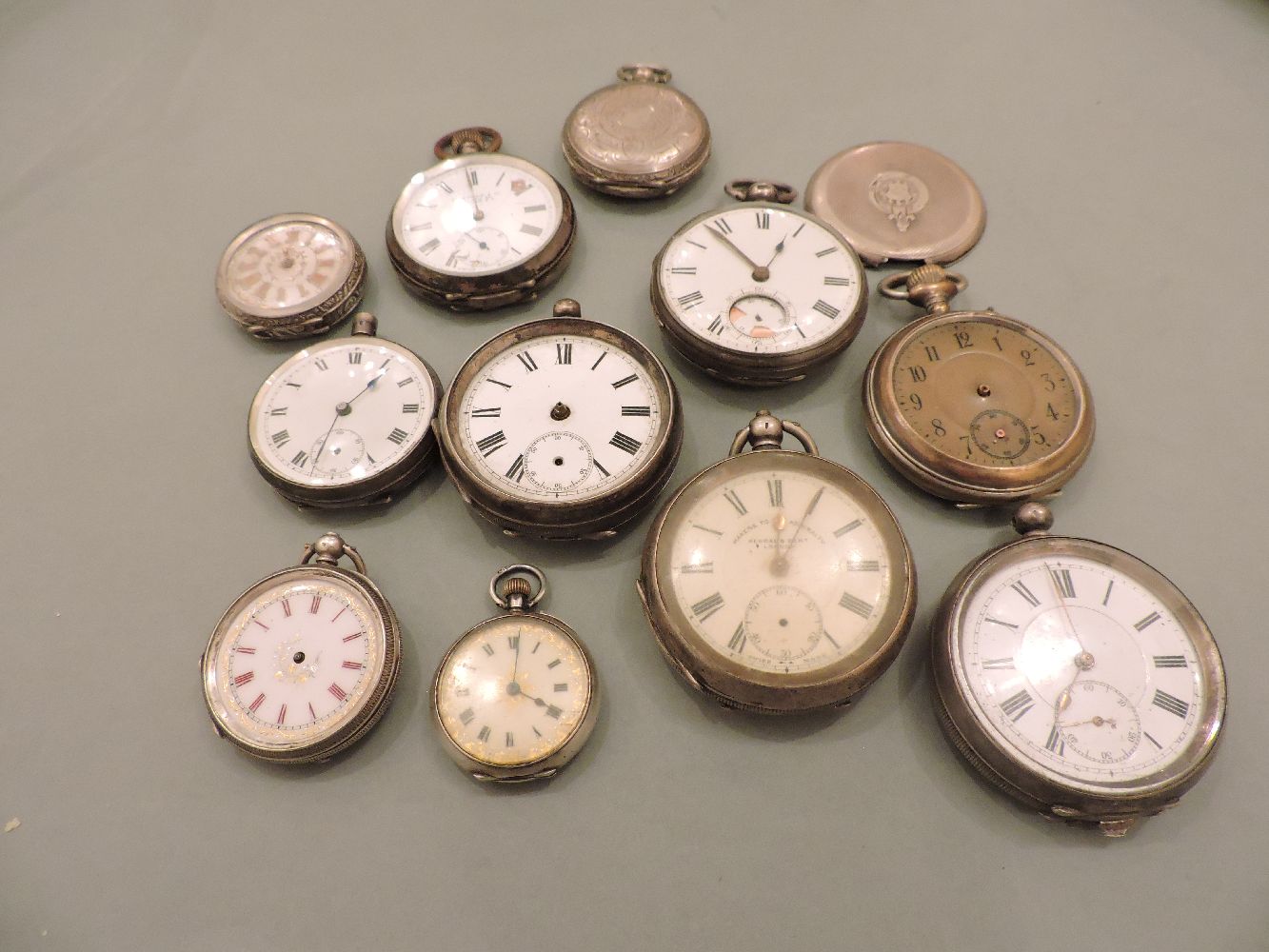 A collection of silver and silver plated pocket watches, to include an engine turned decorated