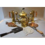 An early 19th century copper warming pan, with turned fruitwood handle, a brass tea kettle, watering