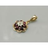A 9ct gold illusion set diamond and ruby cluster pendant