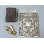 A Victorian mother of pearl and silver pierced card case, 10cm, and a brass travelling eye piece