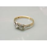 A two stone old European cut diamond ring, stamped 18ct
