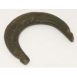 A 19th century tribal crescent shaped horn amulet, with notched ends and hatched decoration, 14.