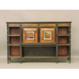 A Victorian Aesthetic burr walnut and ebonised side cabinet, with mirrored doors, four drawers and