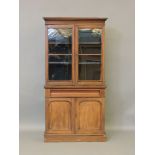 A Victorian mahogany bookcase on cupboard, 88.5cm wide, 170cm high