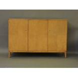 A large maple sideboard, with three cupboards