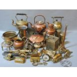 Two boxes of old copper and brassware, including a brass miner's lamp, and three kettles on stands