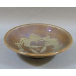 A lustre pottery bowl, with an interlaced rabbit design