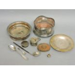 A collection of silver and silver plate, including two wine coasters, one pierced, a toddy ladle,