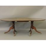 A mahogany twin pedestal dining table, the solid top with a single leaf, 210cm long