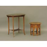 An Edwardian strung and inlaid mahogany oval table, on square tapering legs, 67cm wide, and an