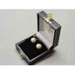 A pair of cultured pearl clip on earrings, with rope twist mounts, and a two row graduated