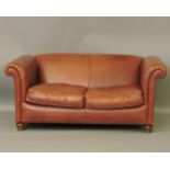 A modern leather two seater settee