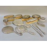 Silver backed dressing table items, comprising two hand mirrors, six brushes, three jars, two button