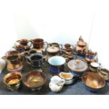 A collection of 19th century copper lustre jugs, cups, etc