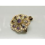 An Edwardian amethyst and split pearl brooch pendant, in the form of a flower, stamped 9ct