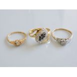 Two diamond rings, marked 18ct, and a cubic zirconia ring marked 750