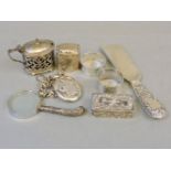 An assortment of silver, comprising a solid silver shoe horn, two trinket boxes, magnifier,