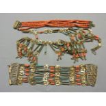 A four row coral bead bracelet, with gilt box clasp, three beads deficient, an Egyptian style blue