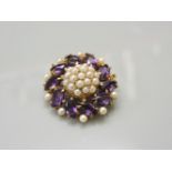 A 9ct gold seed pearl and marquise shaped amethyst cluster brooch, one pearl deficient