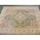 A large grey ground Oriental rug, central medallion with foliate field within multiple banded