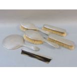 A six piece silver backed dressing set