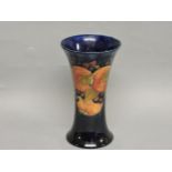 A Moorcroft 'Pomegranate' trumpet vase, restored rim, 21cm high