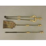 A set of three steel/brass fire irons