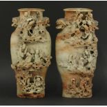 A pair of good soapstone vases, probably Jiaqing (1796-1820), each shield shaped, rust and sage body