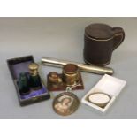 A silver cigar tube, a Victorian folding green glass scent bottle in original case, a miniature of a